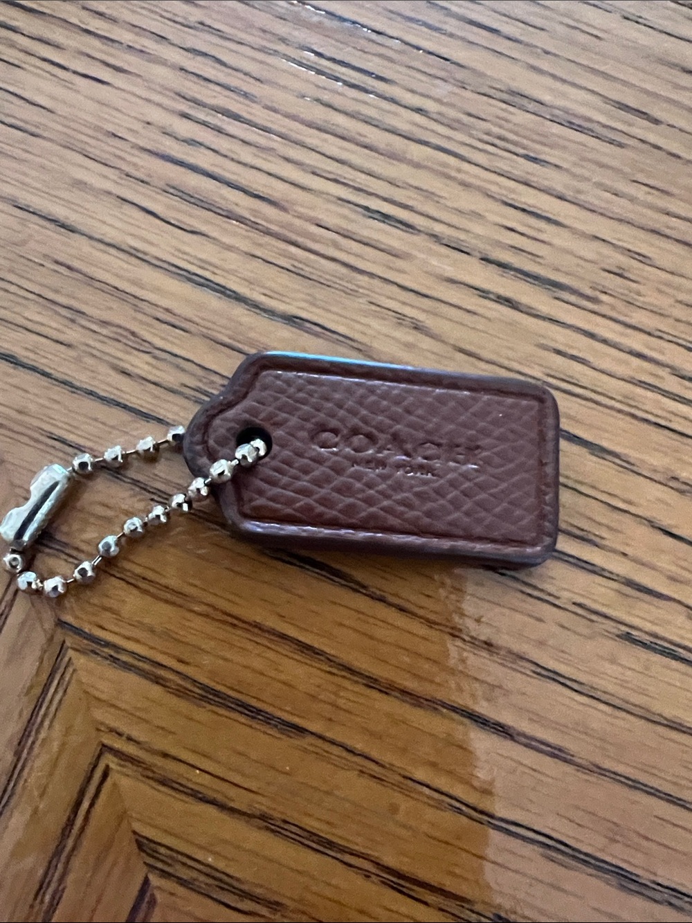Coach Brown Pebbled Leather Key Tag with gold Bead Chain